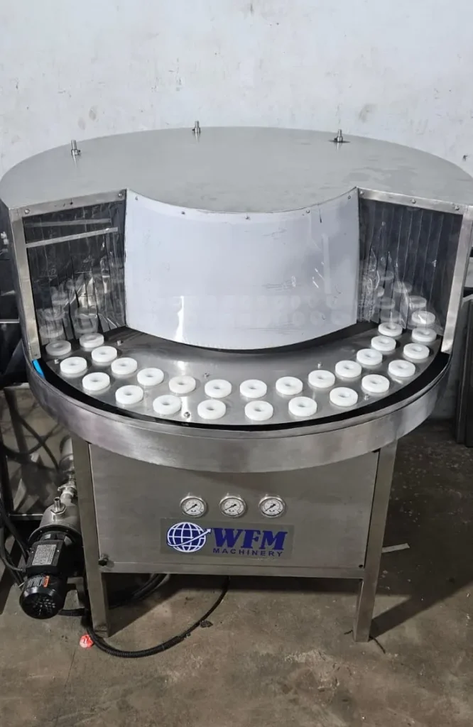 Rotary bottle washing machine